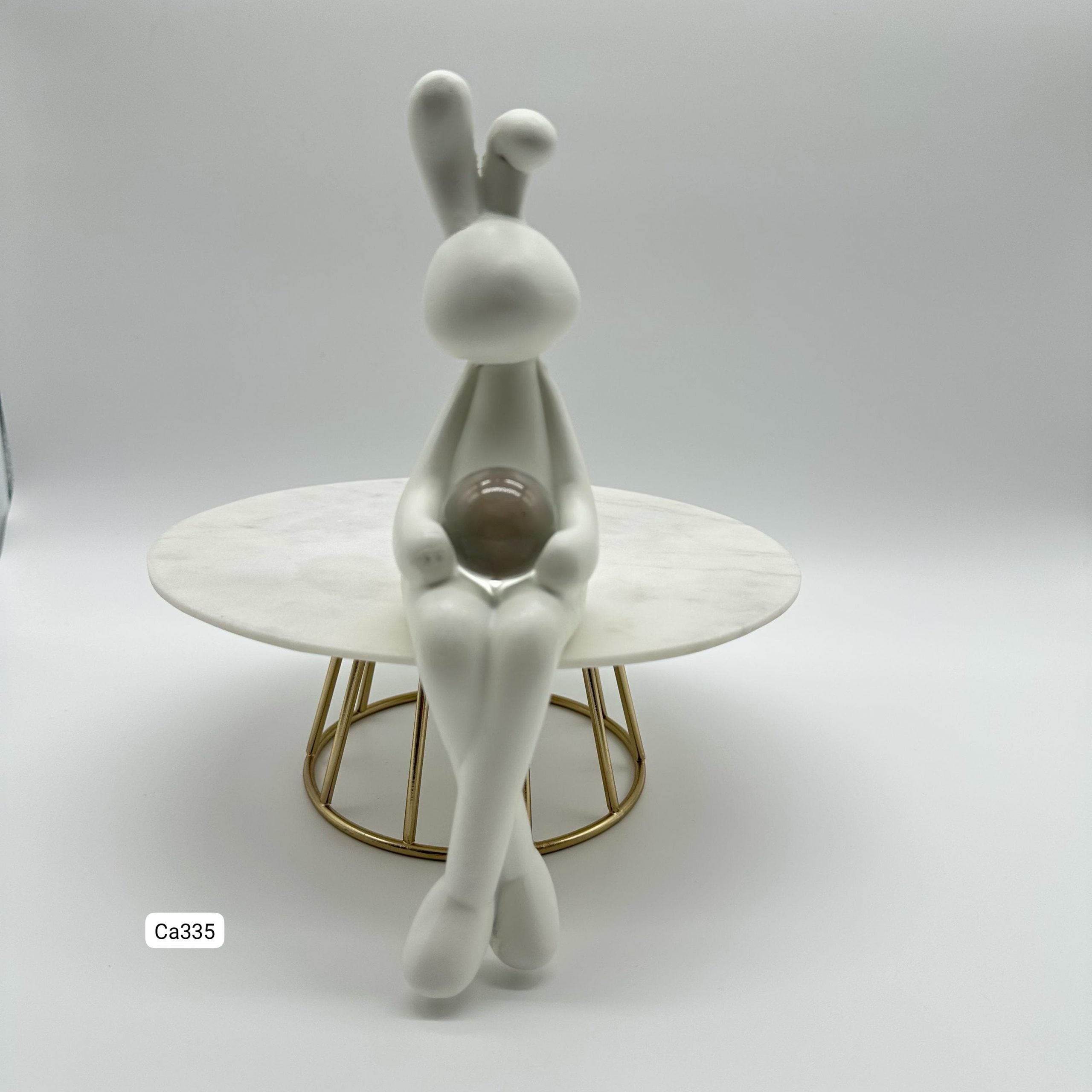 Articulo decorativo conejo blanco piernas cruzadas detalle bola cristal 5,3* 9,3* 19,8cm